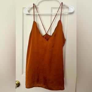 Strappy tank-top, with adjustable straps. Burnt orange color. Size small